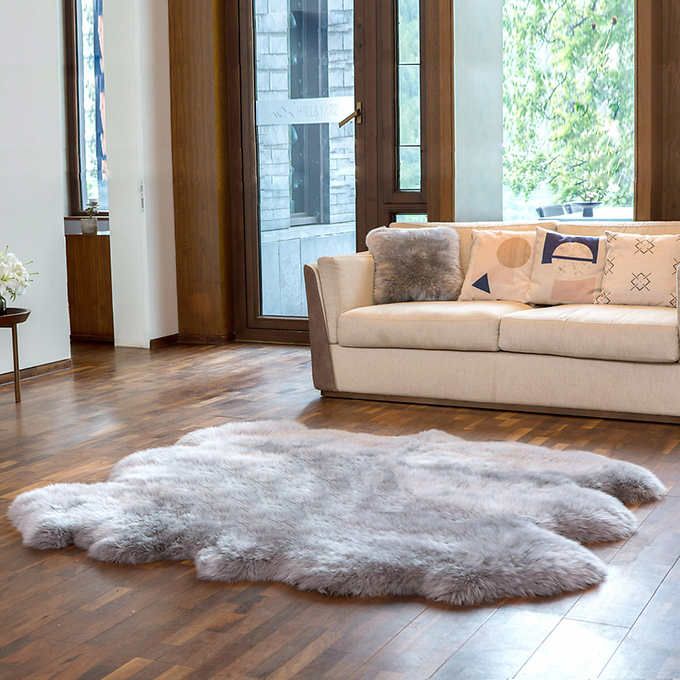 Grey sheepskin rug in a modern living room